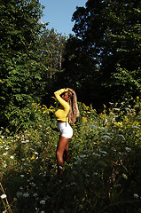 Image showing Young Jamaican girl in the woods.