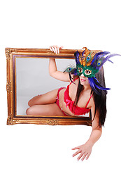 Image showing Masked woman in picture frame.