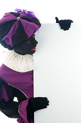 Image showing Zwarte Piet looking at a white board, to put your text in.