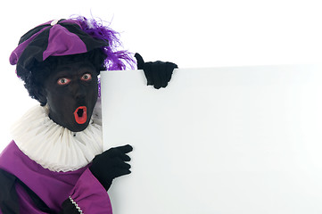 Image showing Zwarte Piet looking at a white board, to put your text in.