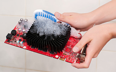 Image showing Hands cleaning the cooler