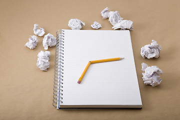 Image showing crumpled paper and crushed yellow pencil