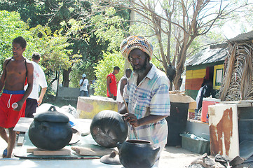 Image showing rasta man preparing food 319