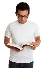 Image showing University student or man reading a textbook