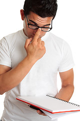 Image showing Student pushing up glasses onto face