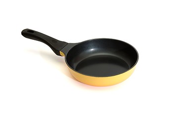 Image showing Black and yellow frying pan isolated