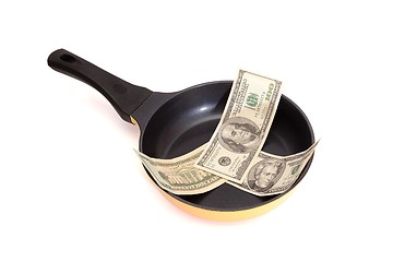 Image showing Frying pan with dollar bills isolated