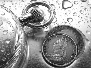 Image showing Watch and Silver Coin