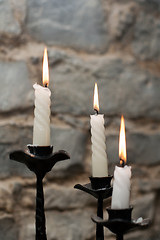 Image showing Three candles in candlestick