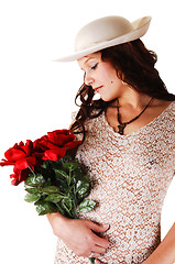 Image showing Woman with hat and red roses.