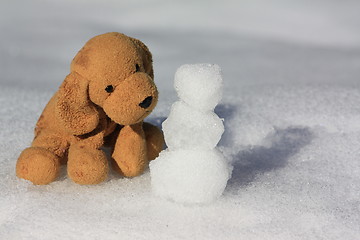 Image showing Dog making a snowman