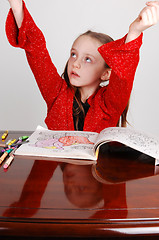 Image showing Little girl coloring.