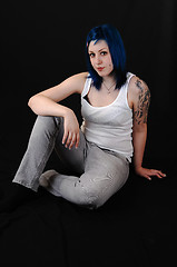 Image showing Blue hair girl sitting.