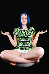 Image showing Blue hair girl meditating.