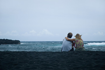 Image showing Couple sitting on the sand