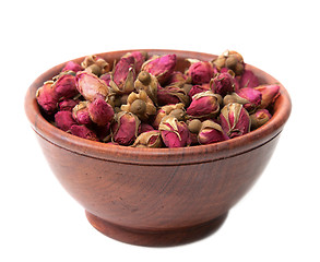 Image showing Dry rose in wooden cup