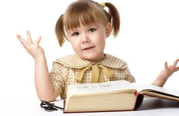 Image showing Happy little girl with book, back to school