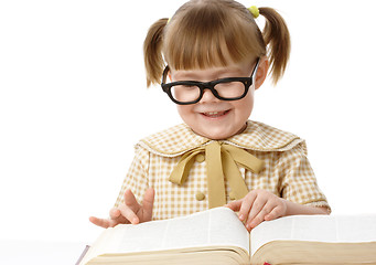 Image showing Cute little girl reads book, back to school