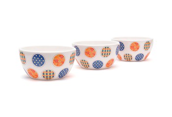 Image showing Row of porcelain bowls isolated