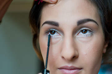 Image showing Applying makeup
