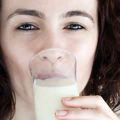 Image showing Young people eating milk.