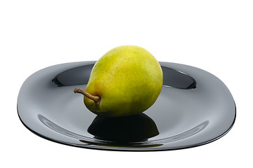 Image showing Pear on a black platte, isolated