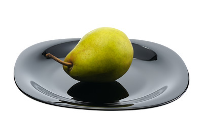 Image showing Pear on a black platte, isolated