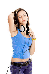 Image showing Young girl listen music