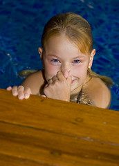 Image showing cute preteen in a swimming pool