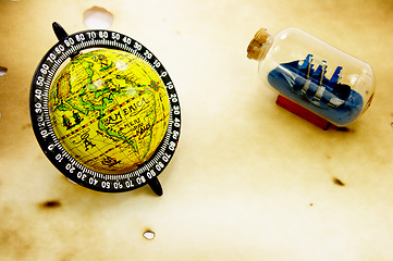 Image showing Antique globe and bottle