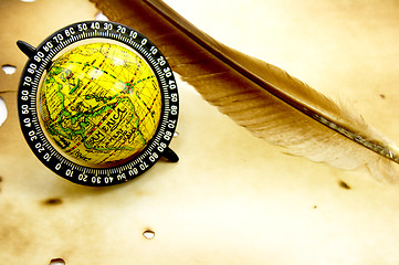 Image showing Antique globe and feather