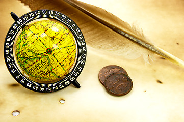 Image showing Antique globe and feather