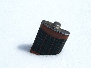 Image showing flask on snow