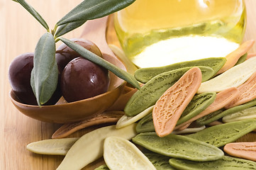 Image showing pasta, black olives, oil with fresh branch. food ingredients 