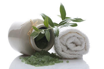 Image showing fresh olive branch and bath salt. spa