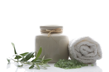 Image showing fresh olive branch and bath salt. spa