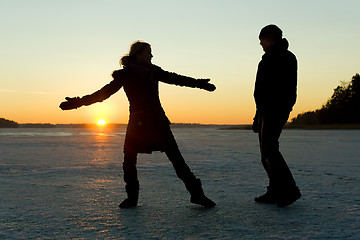 Image showing Silhouette of couple having fun on ice