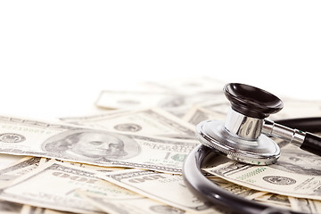 Image showing Stethoscope Laying on Stacks of Money