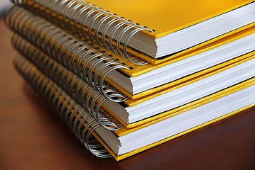 Image showing Yellow notebooks stack