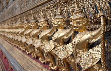 Image showing Golden figures warrior in royal palace