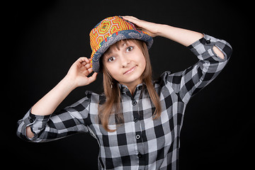 Image showing Beautiful girl in colour hat