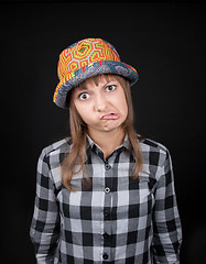 Image showing Young beautiful girl makes faces