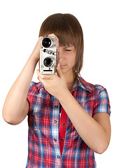 Image showing Girl in plaid shirt with movie camera