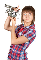 Image showing Girl in plaid shirt with movie camera