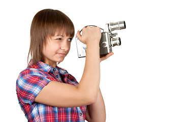 Image showing Girl in plaid shirt with movie camera