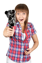 Image showing Girl in plaid shirt with movie camera