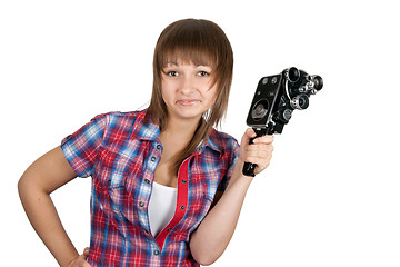 Image showing Beautiful girl in plaid shirt with movie camera