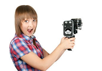 Image showing Beautiful girl in plaid shirt with movie camera