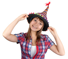 Image showing Young beautiful girl in colour hat