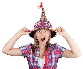 Image showing Young beautiful girl in colour hat